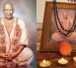 Swami Sivananda portrait with framed devotional photograph