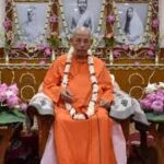 Bhakti spiritual teacher seated before sacred altar inspiring devoted seekers peacefully