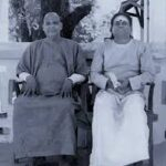 Swami Sivananda with devotee discussing spiritual wisdom