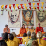 Spiritual discourse with devotees gathered before revered gurus
