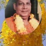 Swami Sivananda portrait with floral garland symbolizing inner transformation