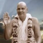 Swami Sivananda blessing devotees with raised hand