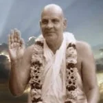 Swami Sivananda blessing devotees with raised hand