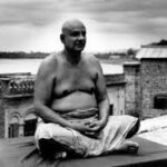 Swami Sivananda meditating peacefully with gratitude and inner silence