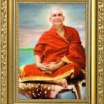 Framed portrait of Swami Sivananda in meditation