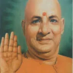 Swami Sivananda offering blessings with raised hand