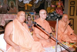 Bhakti Yoga spiritual teachers delivering devotional discourse inside sacred temple together