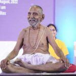 Narsi Mehta seated peacefully during spiritual discourse