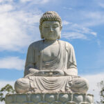 Large Buddha statue in peaceful meditation outdoors