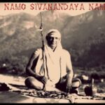Swami Sivananda sitting with Om Namo mantra.