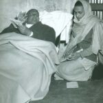 Swami Sivananda guiding disciple during spiritual discussion