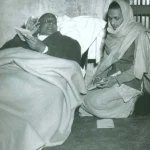 Swami Sivananda guiding disciple during spiritual discussion