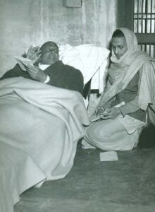 Swami Sivananda guiding disciple during spiritual discussion