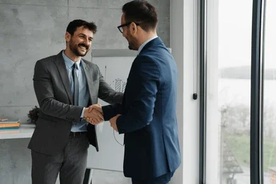 Advice to Businessmen 61 two handsome businessman make business 260nw 2606087661 e1771866908192