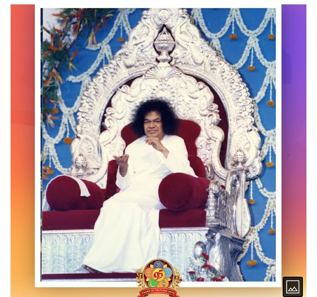 Sri Sathya Sai Baba seated on a beautifully decorated throne during birthday celebrations