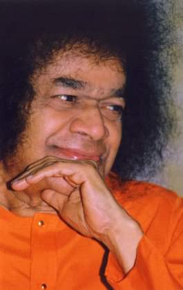Sri Sathya Sai Baba smiling thoughtfully with compassionate peaceful expression always