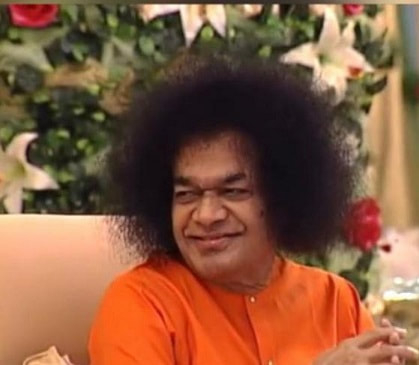 Sri Sathya Sai Baba smiling gently with divine loving grace