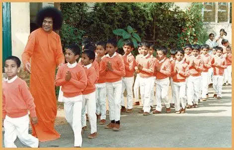 Sri Sathya Sai Baba guiding children with love wisdom and compassion