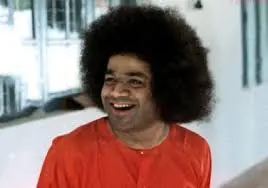 Sri Sathya Sai Baba laughing joyfully with radiant smiling expression always