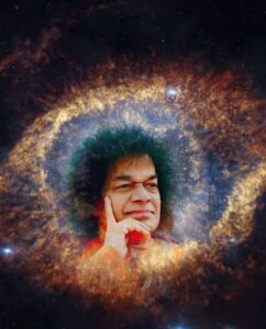 Bhagawan Sri Sathya Sai Baba giving a loving blessing with raised hand