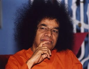 Thoughtful Bhagawan Sri Sathya Sai Baba in deep spiritual contemplation