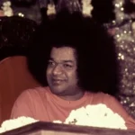Sri Sathya Sai Baba smiling gracefully with divine loving presence always