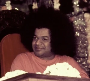 Sri Sathya Sai Baba smiling gracefully with divine loving presence always