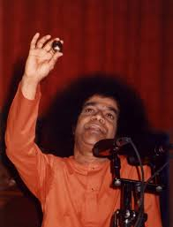 Bhagawan Sri Sathya Sai Baba displaying divine miracle before devotees
