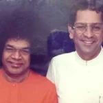 Sri Sathya Sai Baba with translator Anil Kumar smiling together